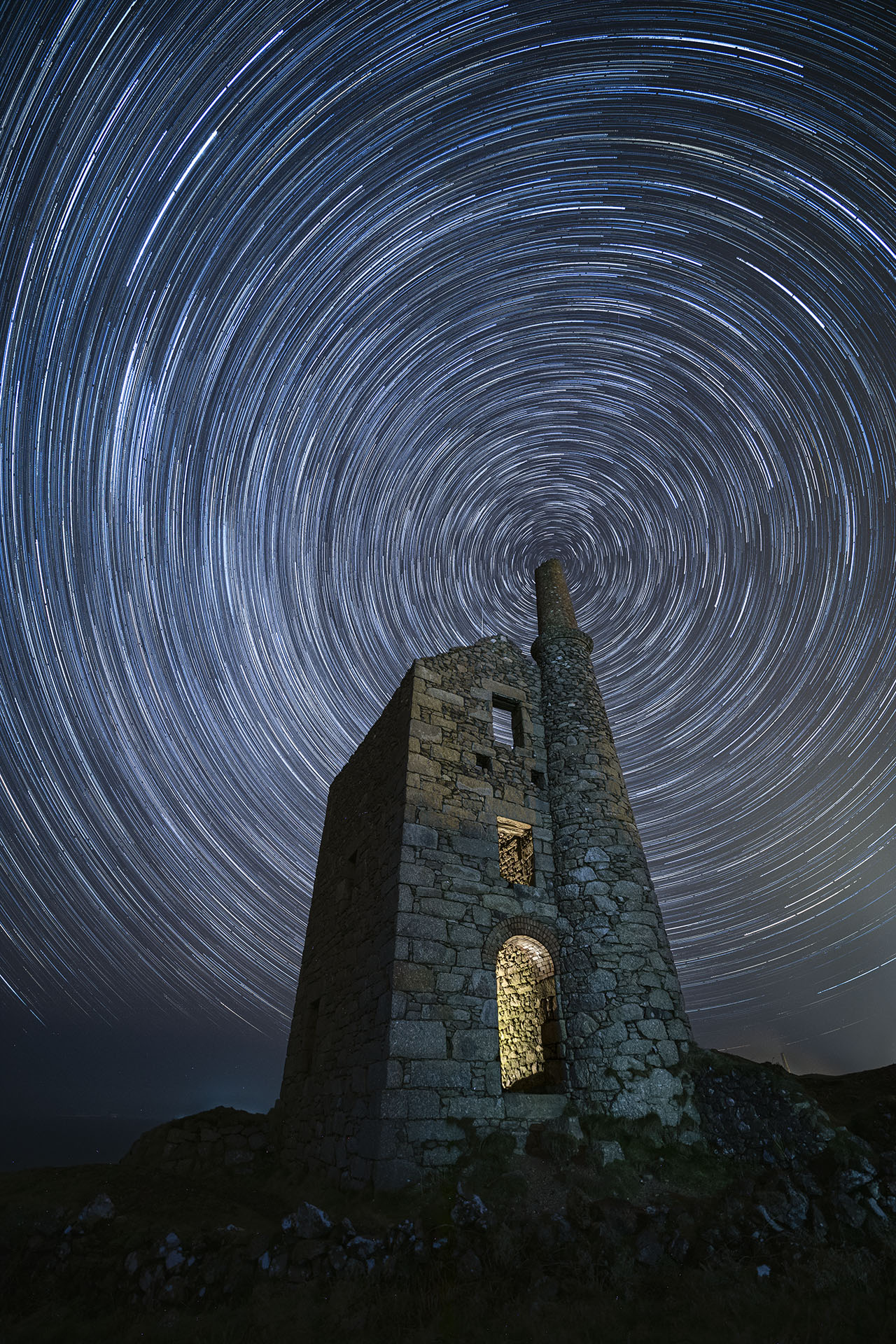 This image of a star trail aligned with the chimney of the former tin mine Wheal Owles in Cornwall 